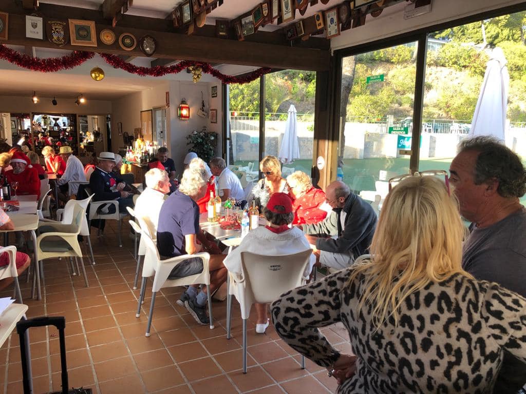 Members enjoying the Miraflores Bowls Club clubhouse at a social event